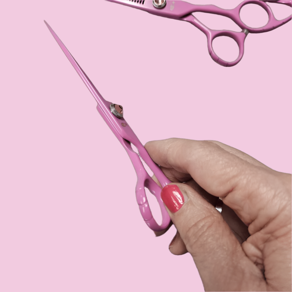 Bonika Cotton Candy Pink ergonomic offset hair cutting shears side view with 440C steel blades